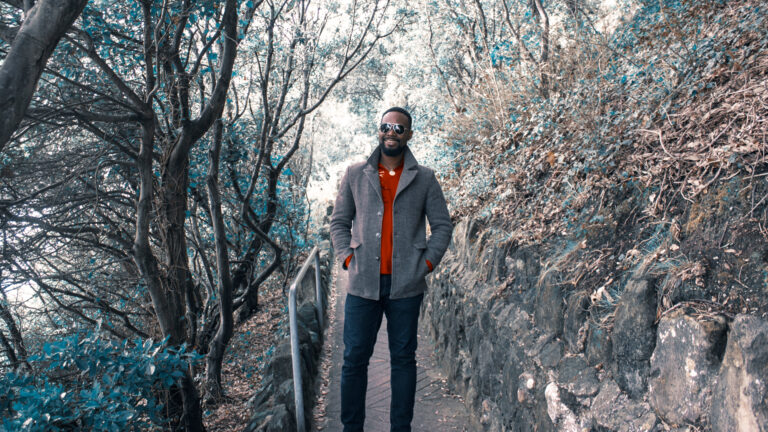 GiwHa standing on a narrow path in a woodland area